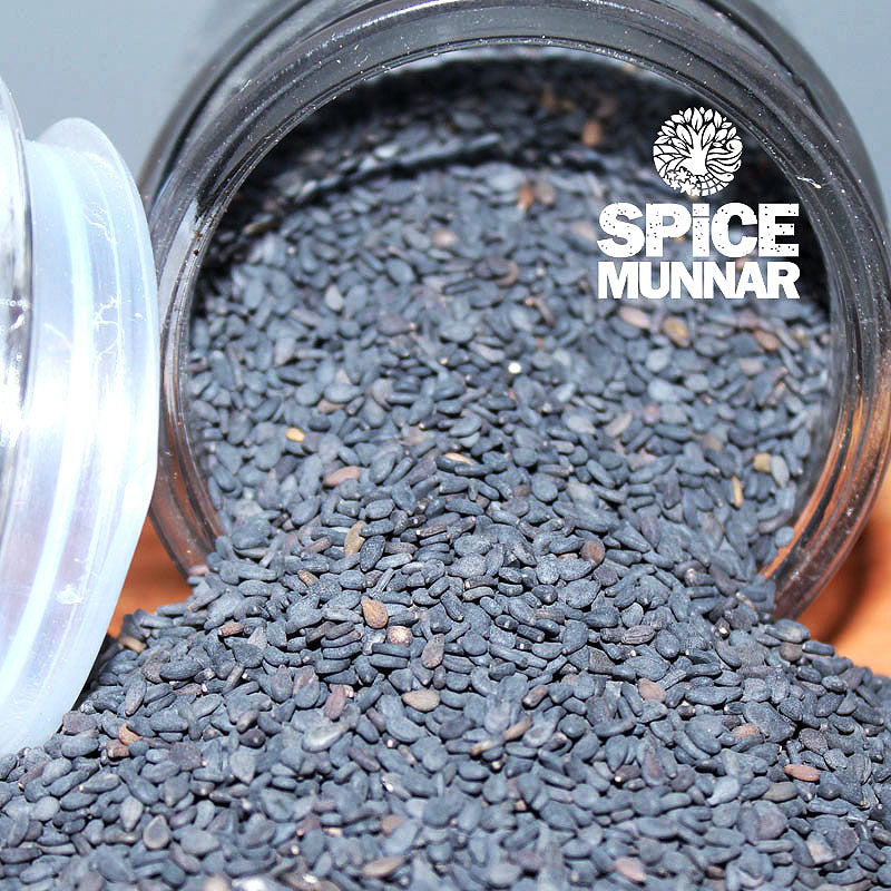 Close-up of a jar filled with black sesame seeds, with 'Spice Munnar' branding.