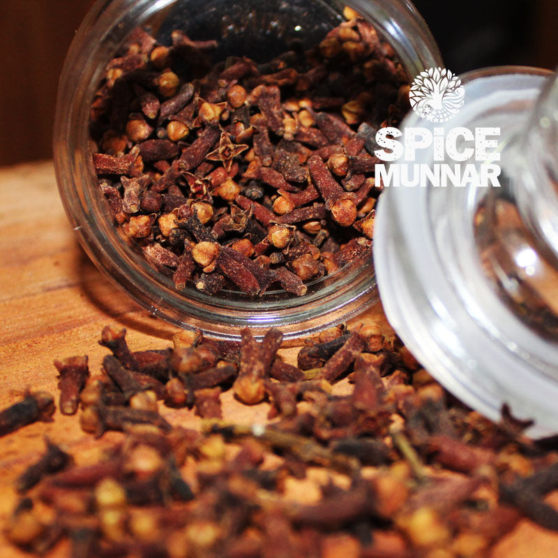Glass jar filled with cloves from 'Spice Munnar' 