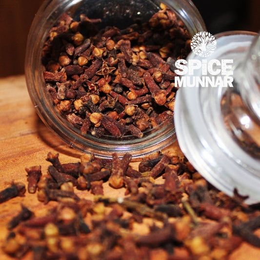 Glass jar filled with cloves from 'Spice Munnar' 