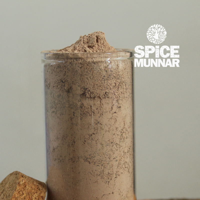 Glass jar filled with Chocolate Coffee  with 'Spice Munnar' branding.
