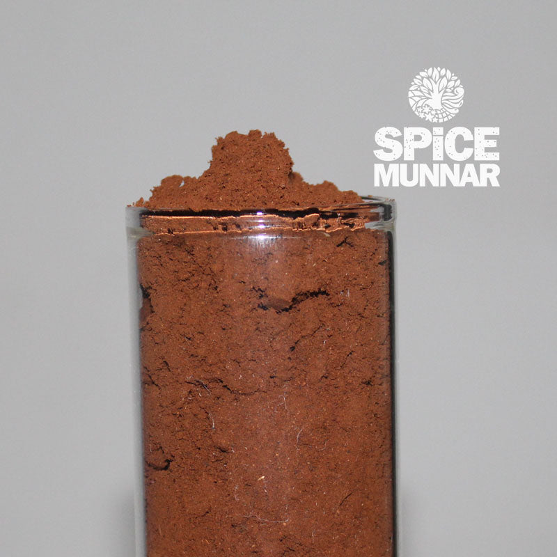 Glass container filled with Organic Coffee Powder with 'Spice Munnar' branding.
